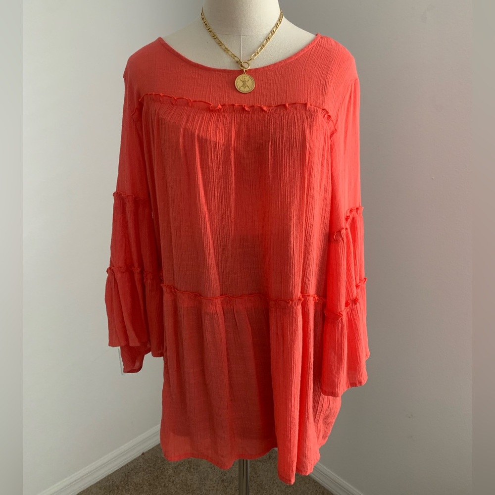 Billowing loose, long sleeve blouse.